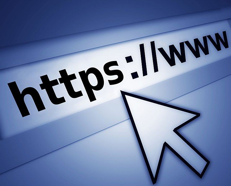 An image of a computer screen at the browser's address bar, with a mouse cursor pointing to indicate the website is using HTTPS.